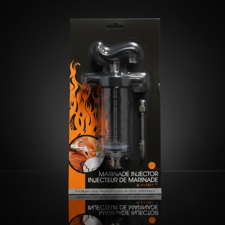 Marinade injector with packaging featuring flames and branding on a white background