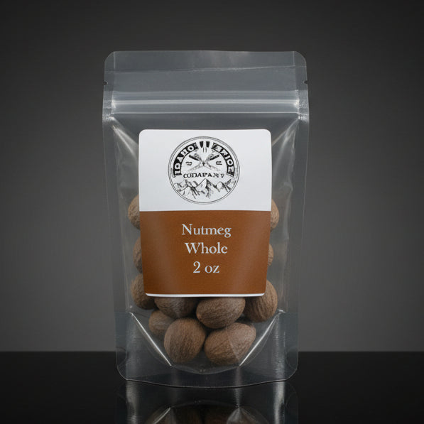 Packaged nutmegs with a label on a dark background