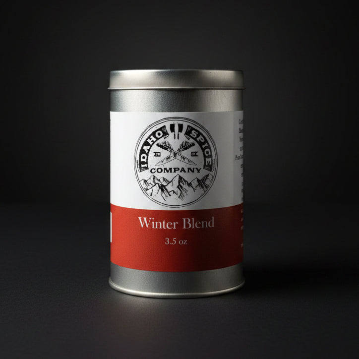 Spice canister labeled 'Winter Blend' from Idaho Spices Company on a dark background