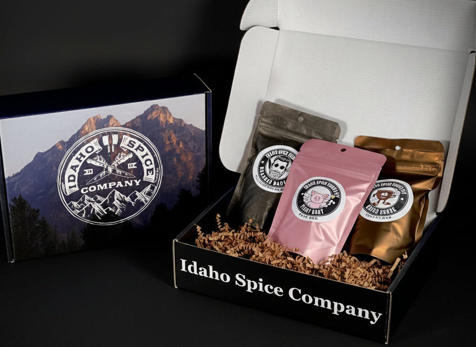 A gift box from Idaho Spice Company containing three packets of barbecue seasonings with unique flavors.