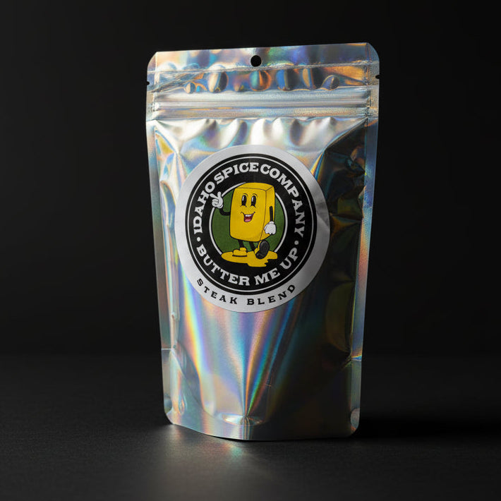 Silver packaging with a logo on a black background