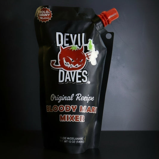Black package of Devil Dave's Bloody Mary Mixer on a dark background