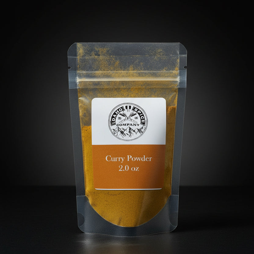Package of curry powder with a label on a wooden surface