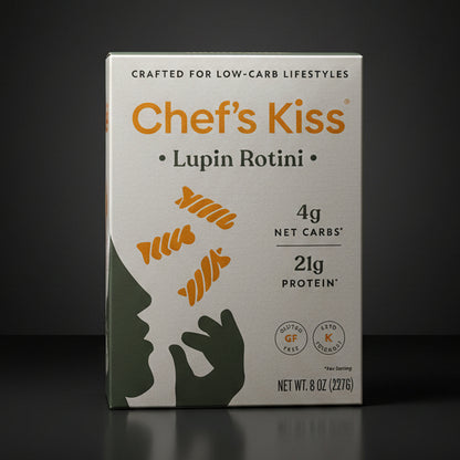 Box of Chef's Kiss Lupin Rotini on a wooden surface