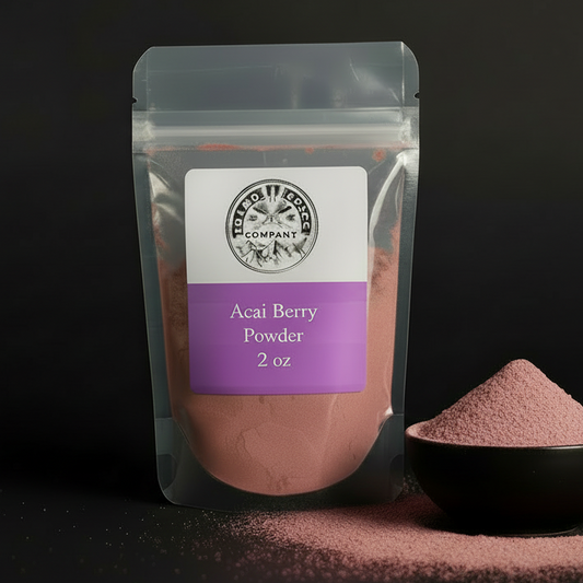Acai berry powder package with a small bowl of powder on a black background