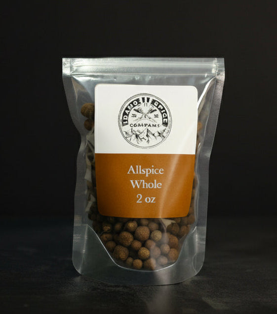 Packaged allspice whole on a dark background