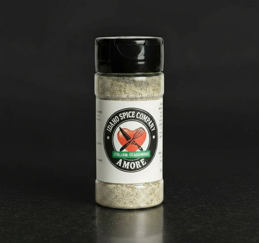 Spice jar labeled 'Idaho Spice Company Amore Italian Seasoning' on a dark background