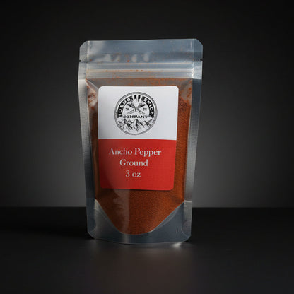 Packaged ground pepper on a dark background