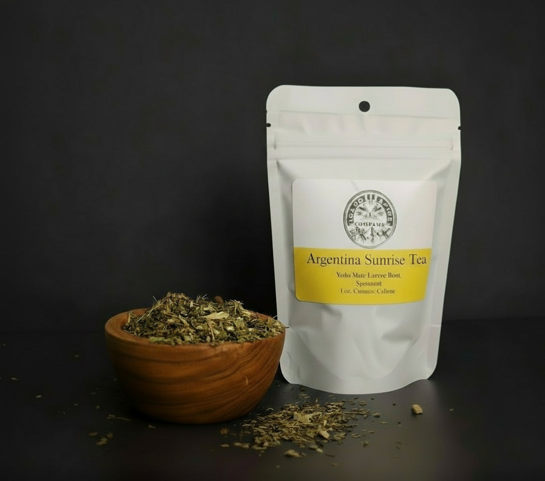 Tea packaging with a wooden bowl of tea leaves on a dark background