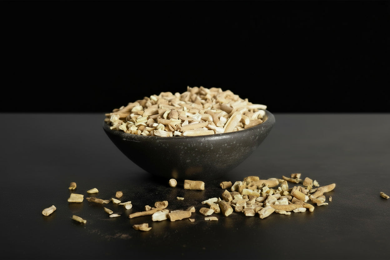 Bowl of Ashwagandha Root on a dark surface with a black background