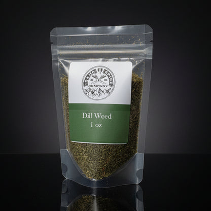 Packaged dill weed on a wooden surface with a dark background