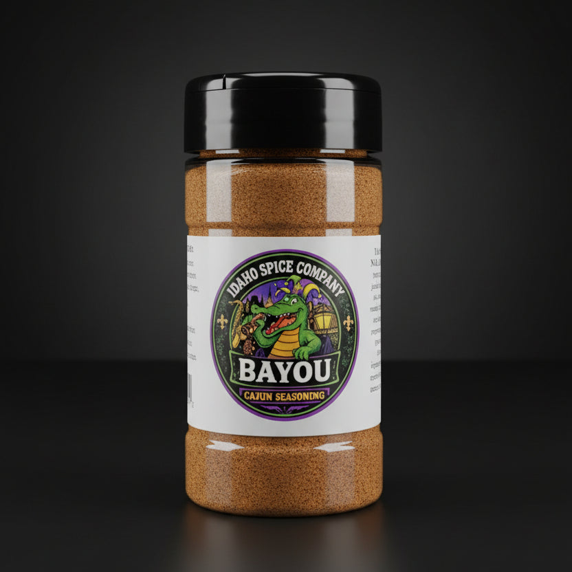Spice jar labeled 'Bayou Cajun Seasoning' from Idaho Spice Company on a dark background