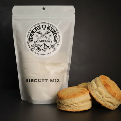 Bag of biscuit mix with biscuits on a dark background
