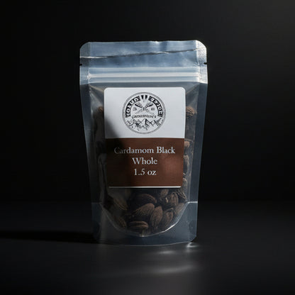 Packaged cardamom black whole on a dark background