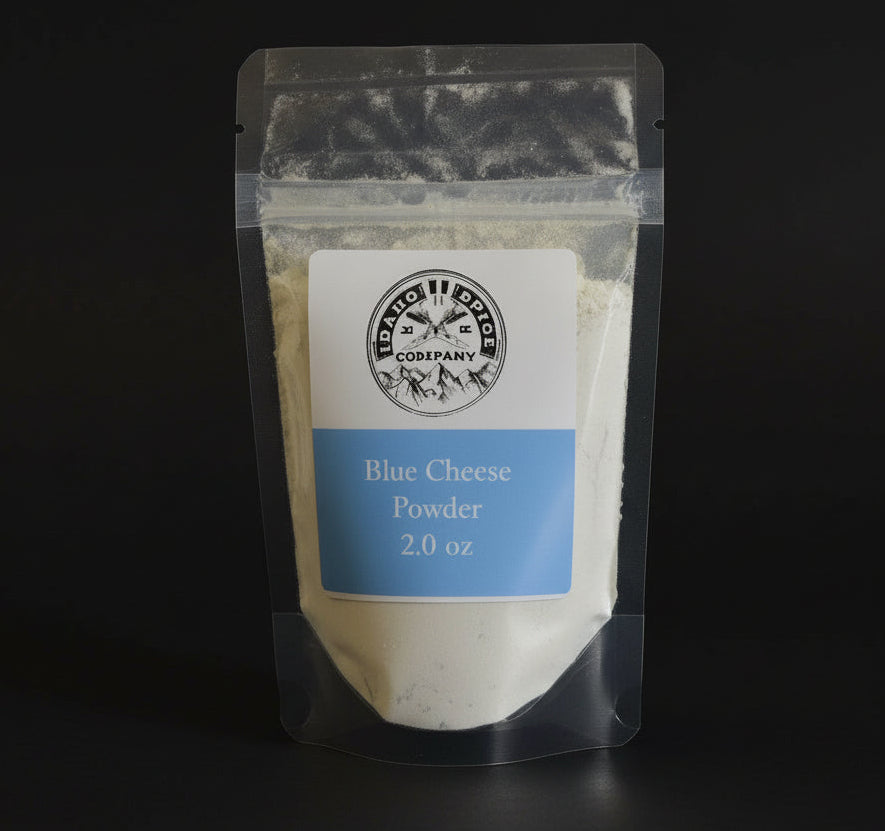 Package of blue cheese powder with a label on a dark background
