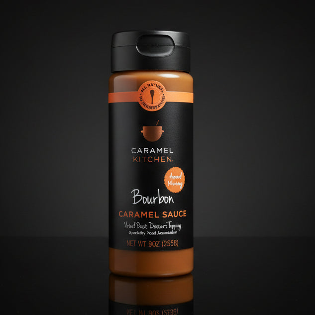 Bottle of Bourbon Caramel Sauce from Caramel Kitchen on a black background