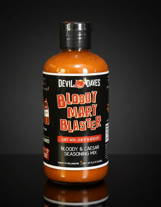 Bottle of Devil Daves Bloody Mary Blaster seasoning mix on a dark surface with a gray background