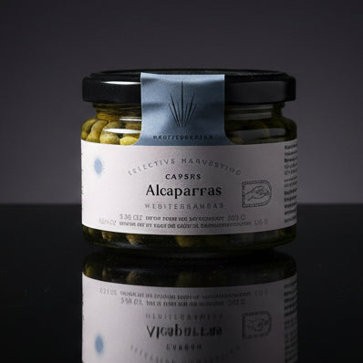 Jar of Alcaparras on a wooden surface with a person wearing dark pants in the background.