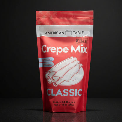 Red package of Crepe Mix with 'American Table' branding on a black background