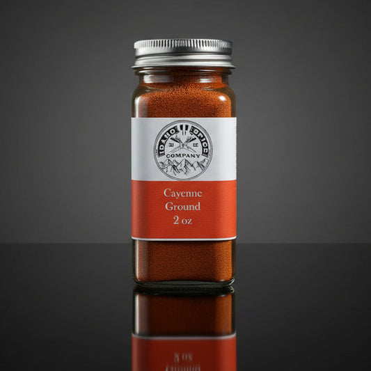 Bottle of cayenne ground with a label on a dark background