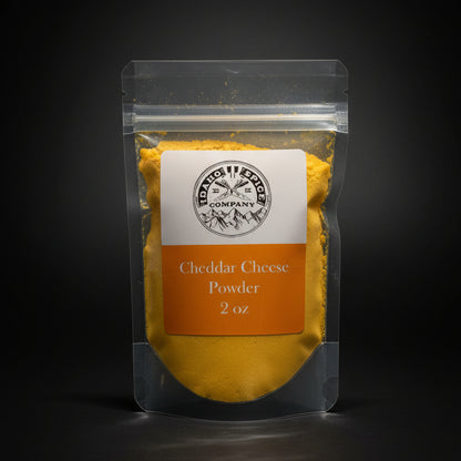 Packaged Cheddar Cheese Powder on a wooden surface with a black background