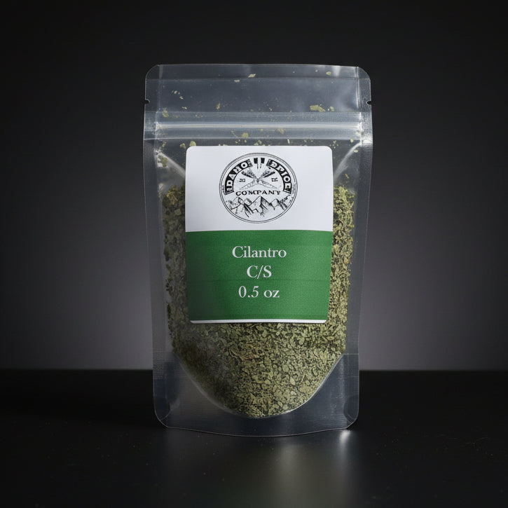 Packaged cilantro with a label on a black background