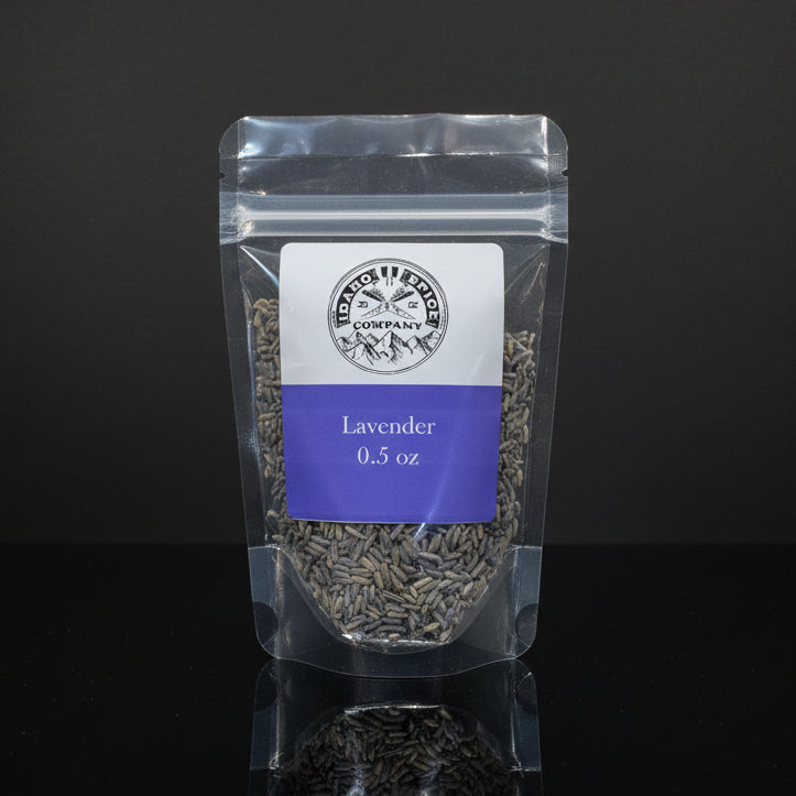 Packaged lavender on a black background with a visible brand label.