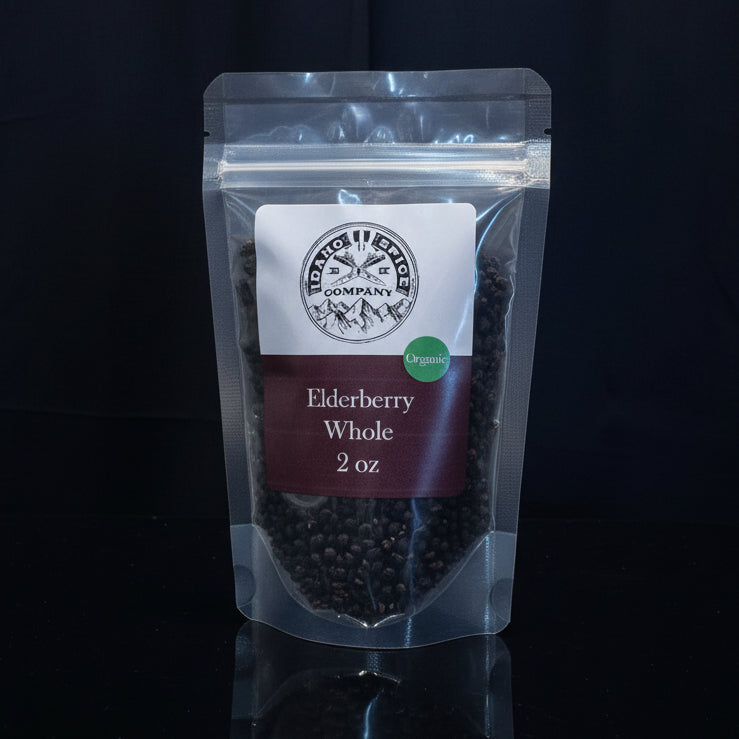 Packaged elderberry on a wooden surface with a dark background