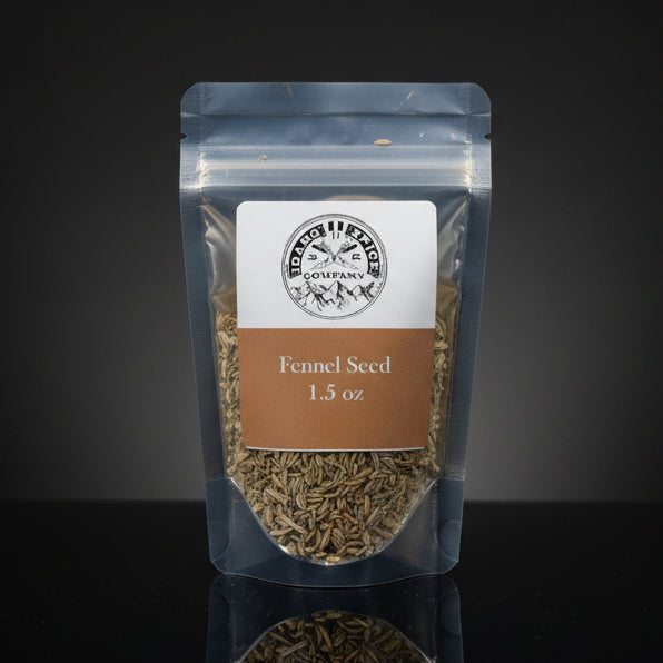 Packaged fennel seeds with a label on a dark background
