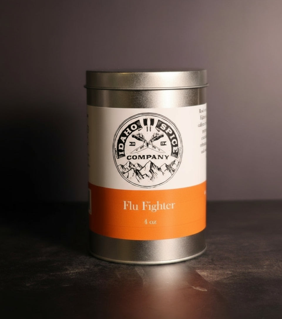 Metal canister labeled 'Flu Fighter' from Idaho Spice Company on a dark background