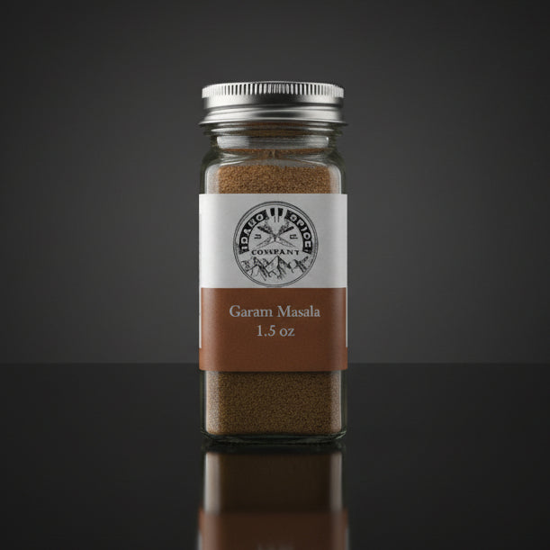 Jar of Garam Masala with a label on a dark background