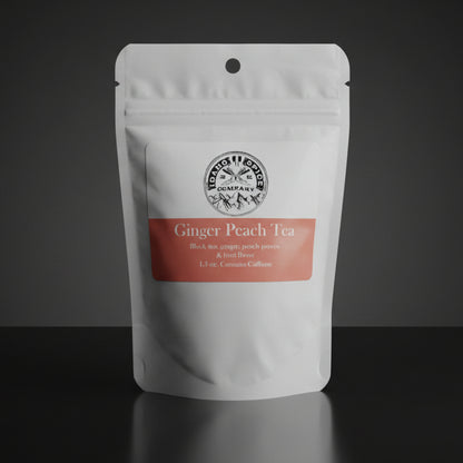 Tea package labeled 'Ginger Peach Tea' on a wooden surface