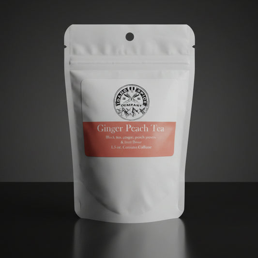 Tea package labeled 'Ginger Peach Tea' on a wooden surface