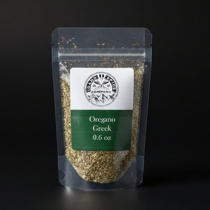 Packaged oregano with a label on a black background