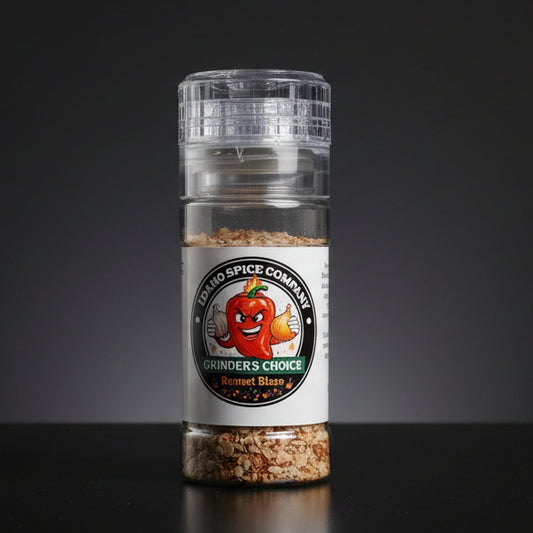 Spice grinder with Idaho Spice Company label on a wooden surface