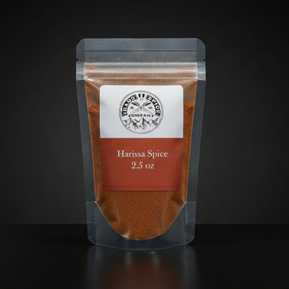 Packaged Harissa Spice with a label on a black background