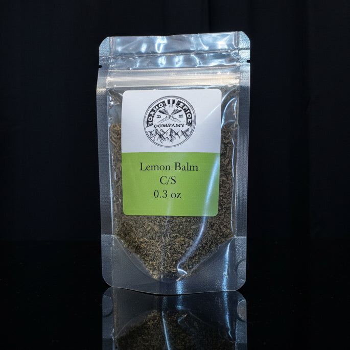 Packaged lemon balm on a black background