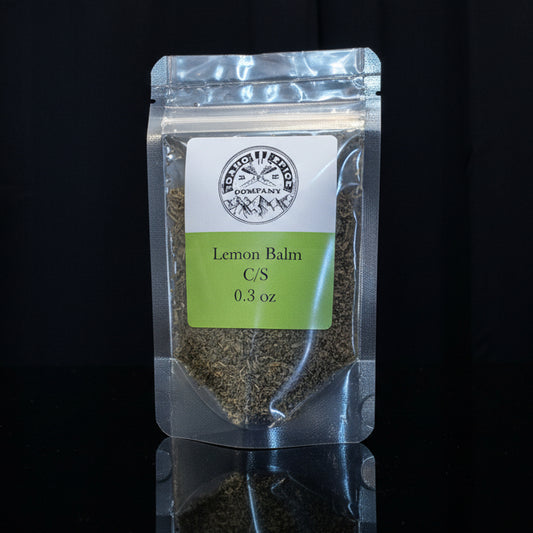 Packaged lemon balm on a black background