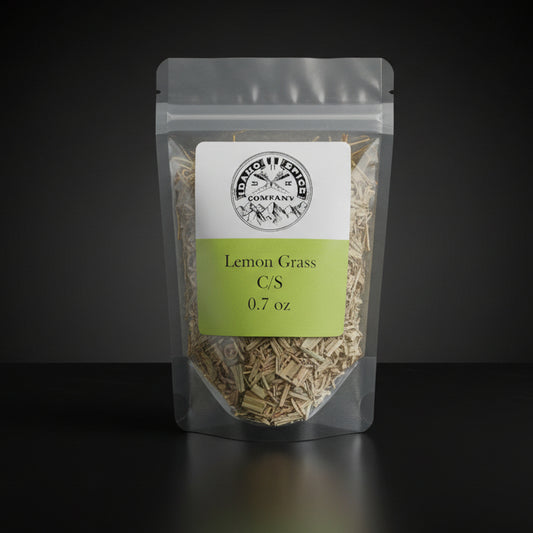 Packaged lemon grass on a black background with a visible brand label.