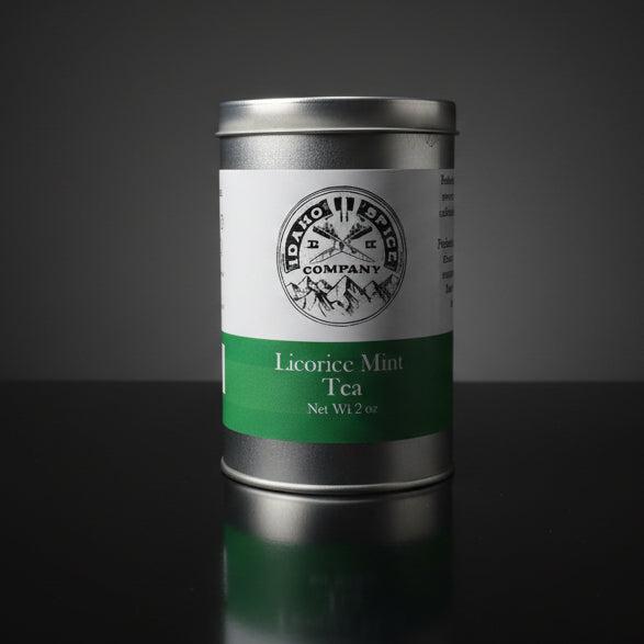 Tea canister with 'Licorice Mint Tea' label on a dark background
