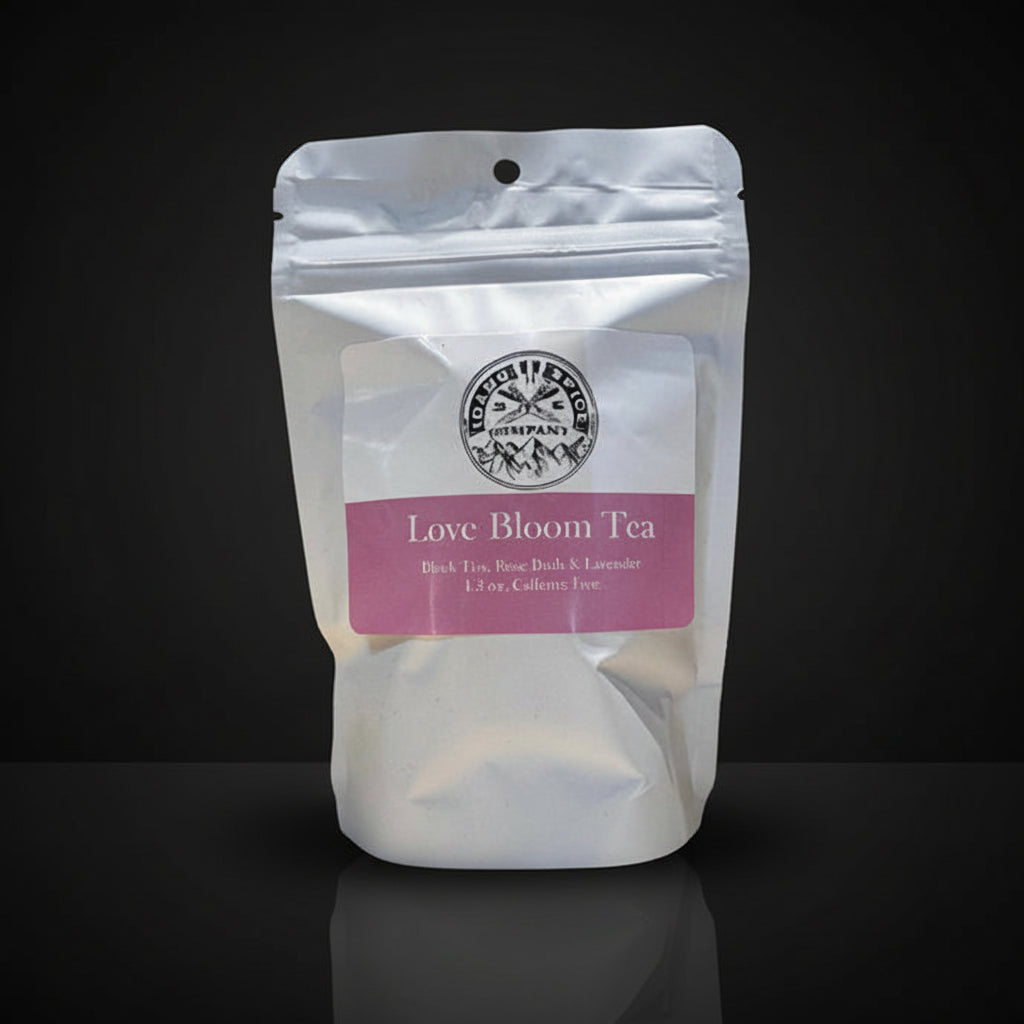 Tea package labeled 'Love Bloom Tea' on a dark background