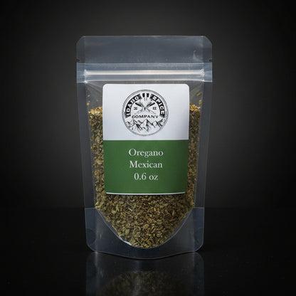 Packaged oregano with a label on a black background