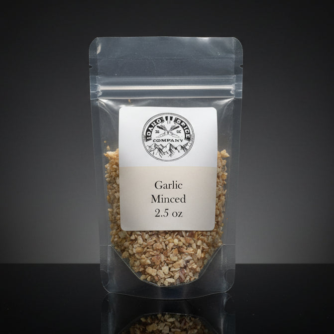 Packaged minced garlic with a label on a dark background
