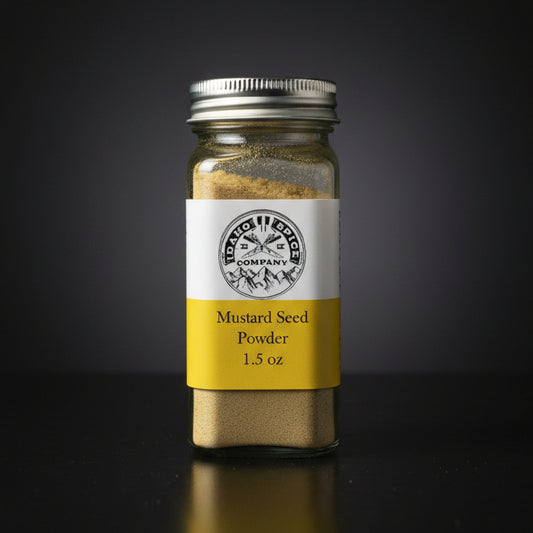Jar of mustard seed powder with a label on a wooden surface