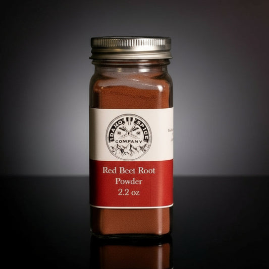 Jar of red beet root powder with a label on a dark background