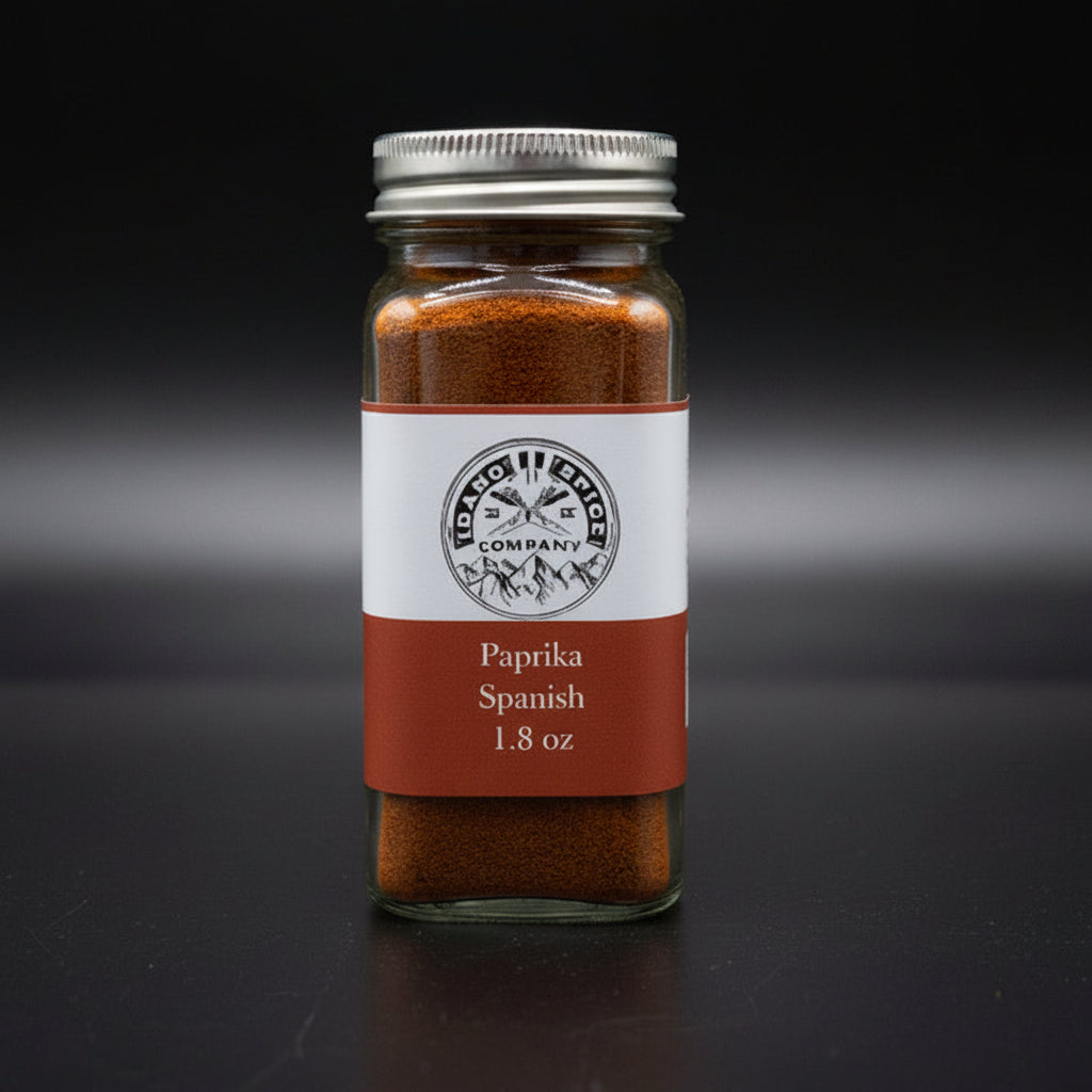 Jar of Spanish paprika with a label on a dark background
