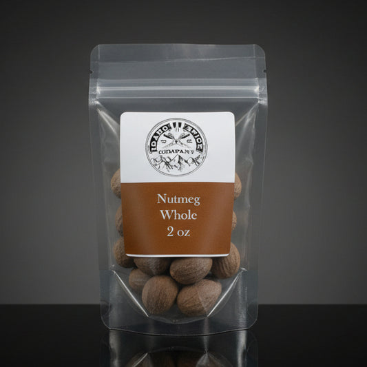 Packaged nutmegs with a label on a dark background