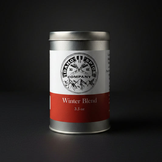 Spice canister labeled 'Winter Blend' from Idaho Spices Company on a dark background