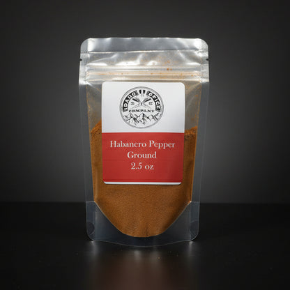 Packaged habanero pepper ground on a dark background